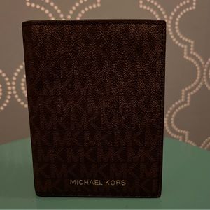 Michael Kors passport wallet.